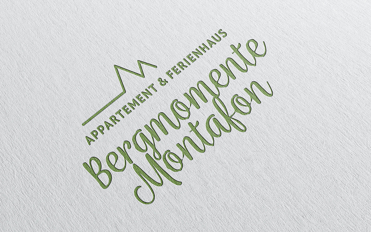 Referenzprojekt des Grafikatelier Montafon als Mockup Logo für Bergmomente Montafon, Ferienwohnung